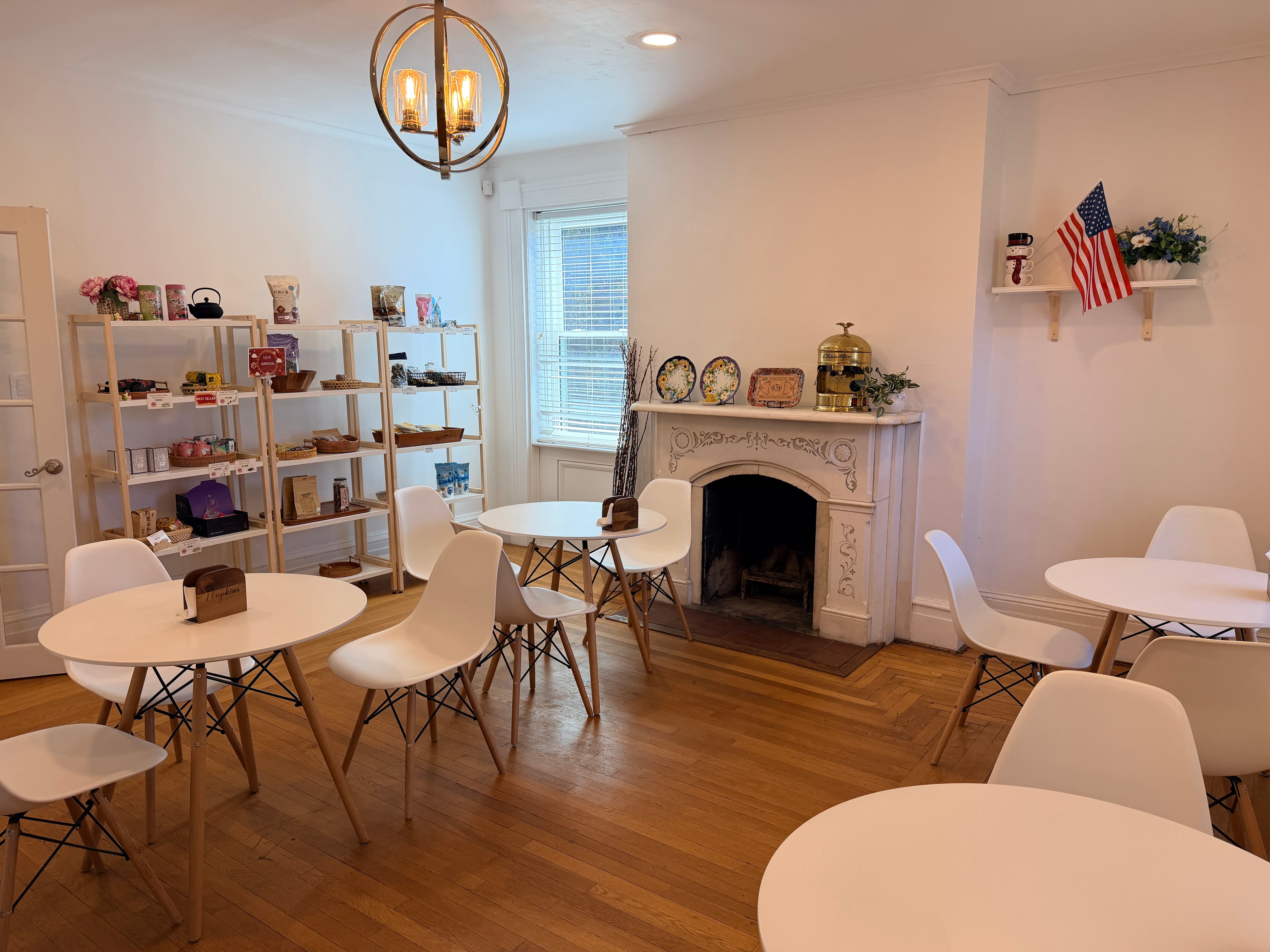 Taiwanese café seating area with chandelier, fireplace and Taiwan shelves in Middletown, NY